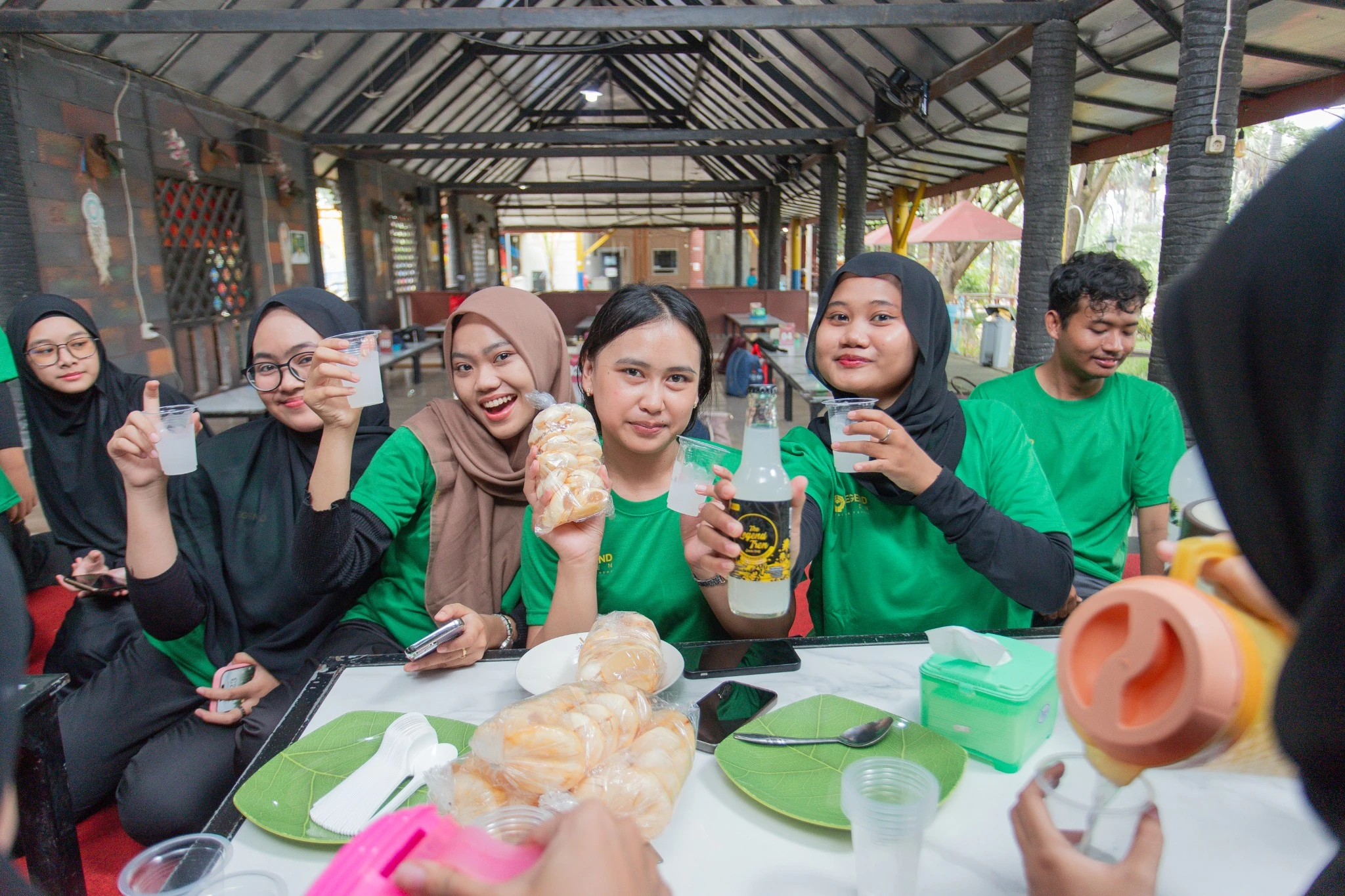 Participants sharing drinks and products together